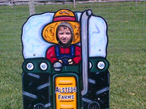One of our cuties trying out for tractor driving
